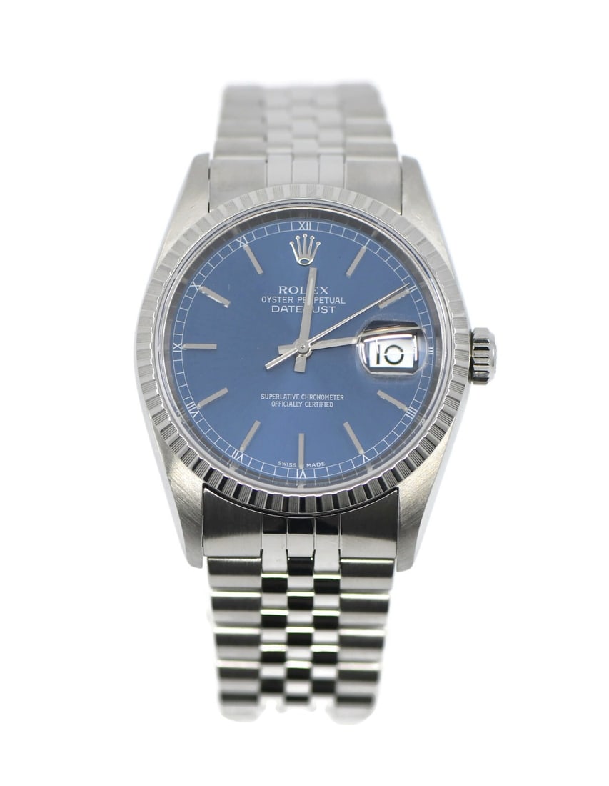 Rolex Datejust 16220 Blue Dial Automatic Wristwatch: Rolex Datejust 16220 Blue Dial Automatic Wristwatch This pre-owned Rolex Datejust wristwatch features a 36mm polished stainless steel case with an engine-turned silver bezel. The blue analog dial is c