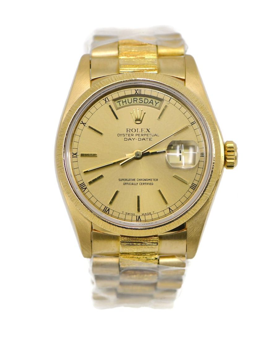 Rolex Day-Date 18078 Bark Finish 18K Gold Automatic Watch With Box and Papers: Rolex Day-Date 18078 Bark Finish 18K Gold Automatic Watch With Box and Papers This Rolex Day-Date Bark wristwatch features an 18K yellow gold case and band, paired with a champagne dial for a classic 