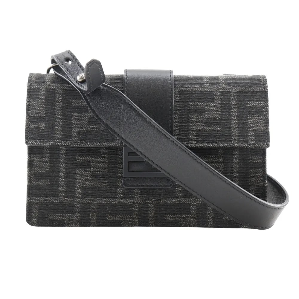 Fendi Baguette Convertible Canvas Belt Bag Black: Fendi Baguette Convertible Canvas Belt Bag Black This Fendi Baguette Convertible Belt Bag is crafted from black Zucca canvas and designed for unisex use. It features a compact size suitable for essent
