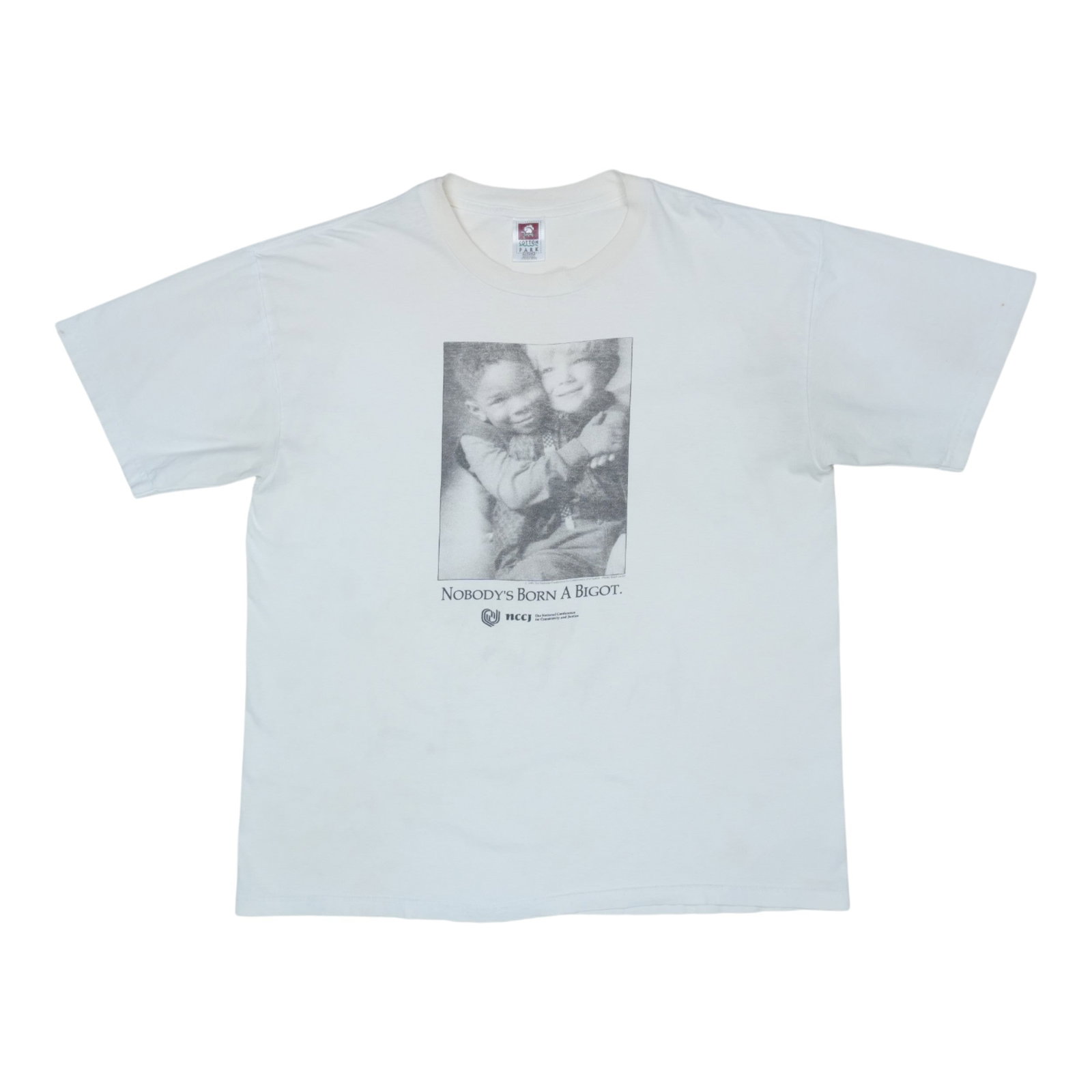 Vintage 1990 Nobody's Born A Bigot White Cotton T-Shirt Extra Large: Vintage 1990 Nobody's Born A Bigot White Cotton T-Shirt Extra Large This is an original vintage 1990 Nobody's Born A Bigot shirt. It is not a modern reproduction and features no graphics on the back. 