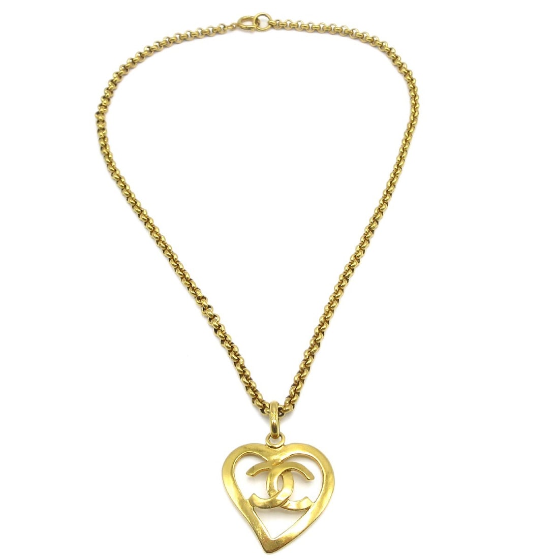 Vintage Chanel 95P Gold Plated Heart Pendant Necklace: Vintage Chanel 95P Gold Plated Heart Pendant Necklace Vintage Chanel pendant necklace with a heart-shaped charm and gold-plated finish. Marked 95P, this necklace is made in France and shows light scra