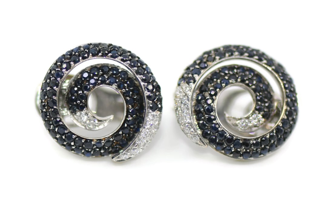 18K White Gold Diamond Swirl Stud Earrings Roberto Coin: 18K White Gold Diamond Swirl Stud Earrings Roberto Coin These elegant swirl earrings feature diamonds set in 18K white gold, crafted in Italy. Designed in a stud style, they offer a sophisticated look