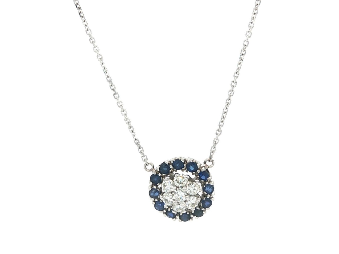 Vintage 18k White Gold Sapphire Diamond Cluster Pendant Necklace: Vintage 18k White Gold Sapphire Diamond Cluster Pendant Necklace This exquisite vintage pendant necklace features a stunning round cluster design crafted from solid 18k white gold. It showcases a capt