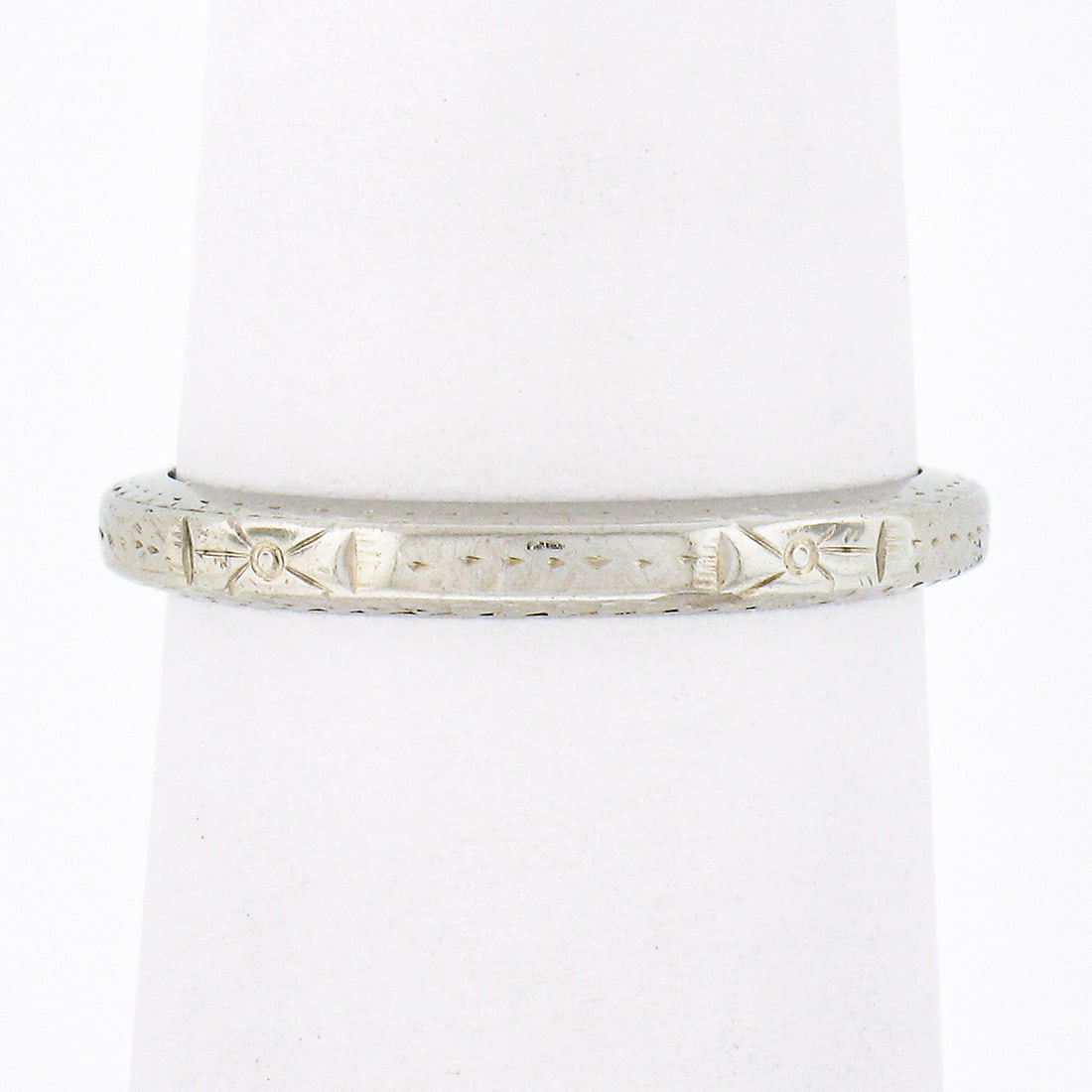 Belais 18k White Gold Engraved Eternity Stack Band Ring: Belais 18k White Gold Engraved Eternity Stack Band Ring This exquisite Antique Art Deco Eternity Stack Band Ring showcases the craftsmanship of Belais, featuring intricate engraved work that encircles
