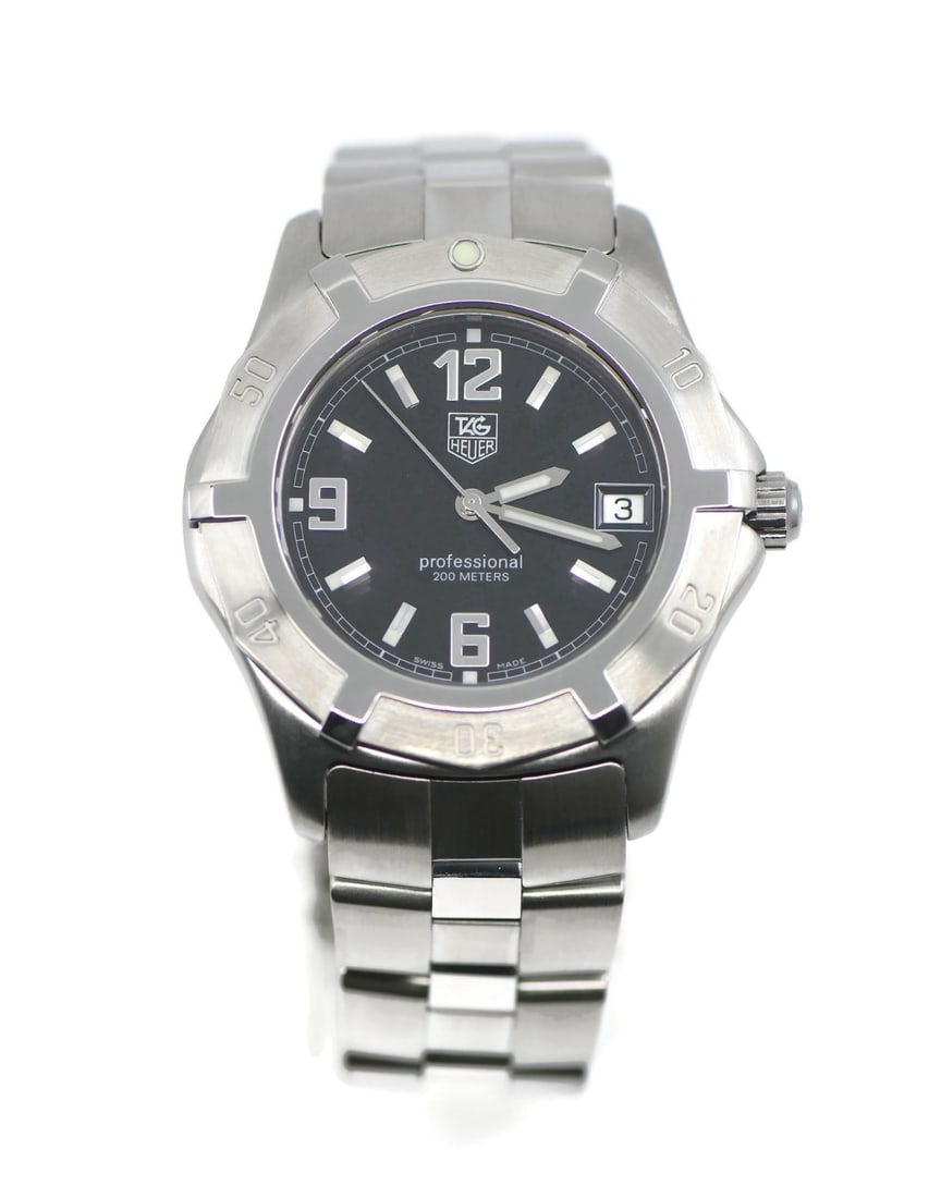 TAG Heuer WN1110 2000 men's stainless steel quartz wristwatch: TAG Heuer WN1110 2000 men's stainless steel quartz wristwatch Pre-owned TAG Heuer 2000 Series men's wristwatch with a black analog dial and stainless steel bracelet. This quartz model features baton i