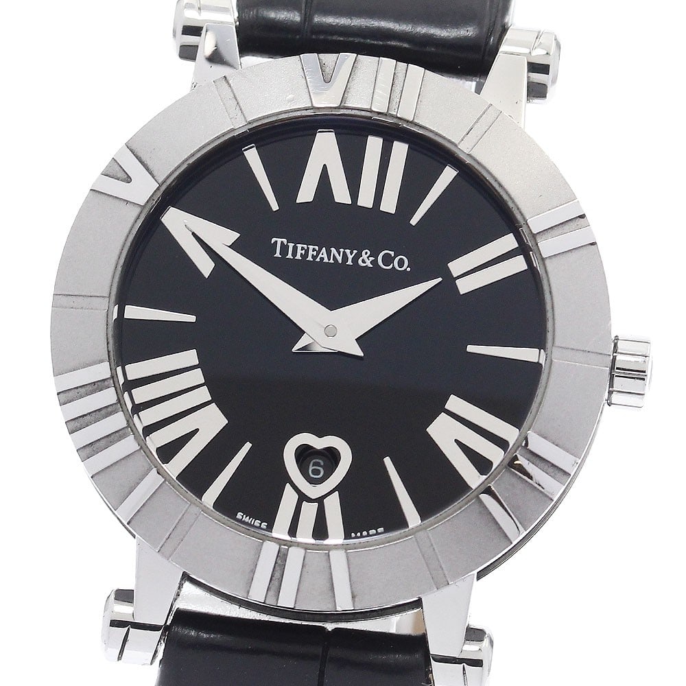 Tiffany Atlas quartz date women s wristwatch 30mm black dial: Tiffany Atlas quartz date women s wristwatch 30mm black dial This Tiffany & Co. Atlas Date Quartz women's wristwatch features a stainless steel case paired with a black leather bracelet. The watch is 