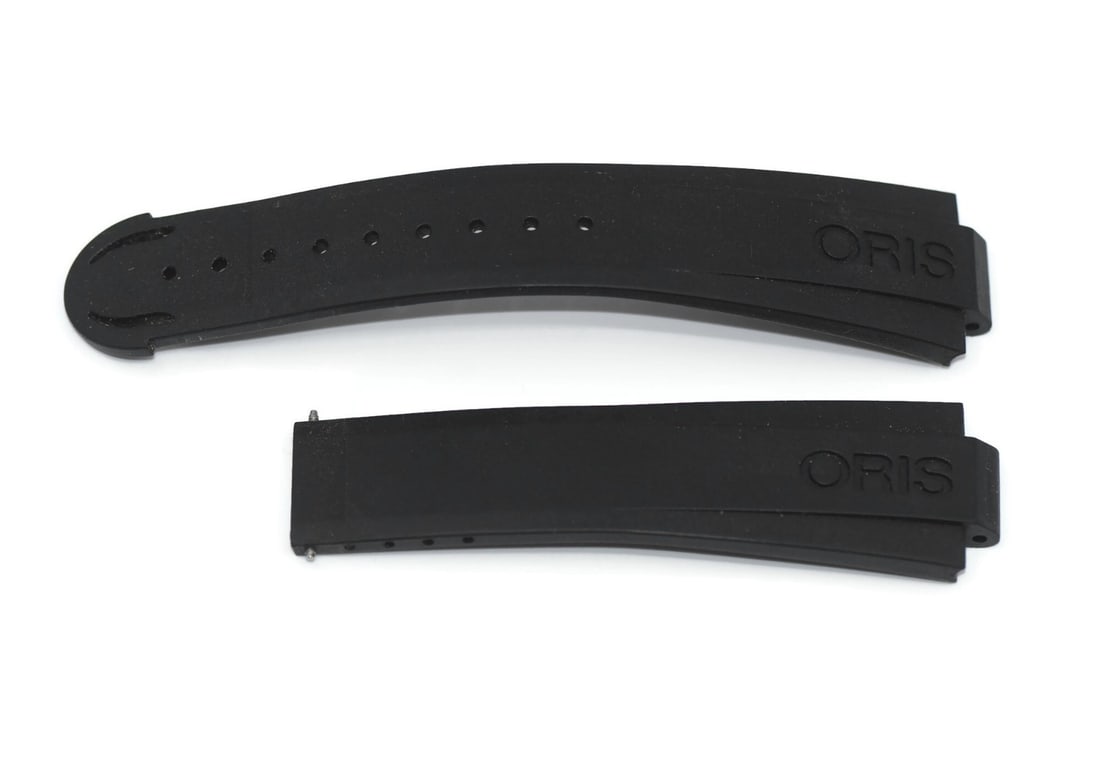 Authentic Oris 21mm Black Rubber Wristwatch Strap: Authentic Oris 21mm Black Rubber Wristwatch Strap Enhance your wristwatch with this authentic Oris Black Rubber Strap. Designed for comfort and durability, this strap is perfect for those seeking a st