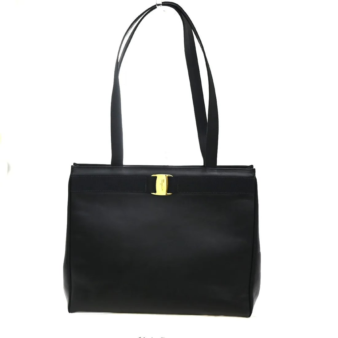 Black Leather Vala Tote Bag by Salvatore Ferragamo: Black Leather Vala Tote Bag by Salvatore Ferragamo This Salvatore Ferragamo Vala tote features a black leather exterior and is designed for women. Crafted in Italy, the bag displays signs of previous 