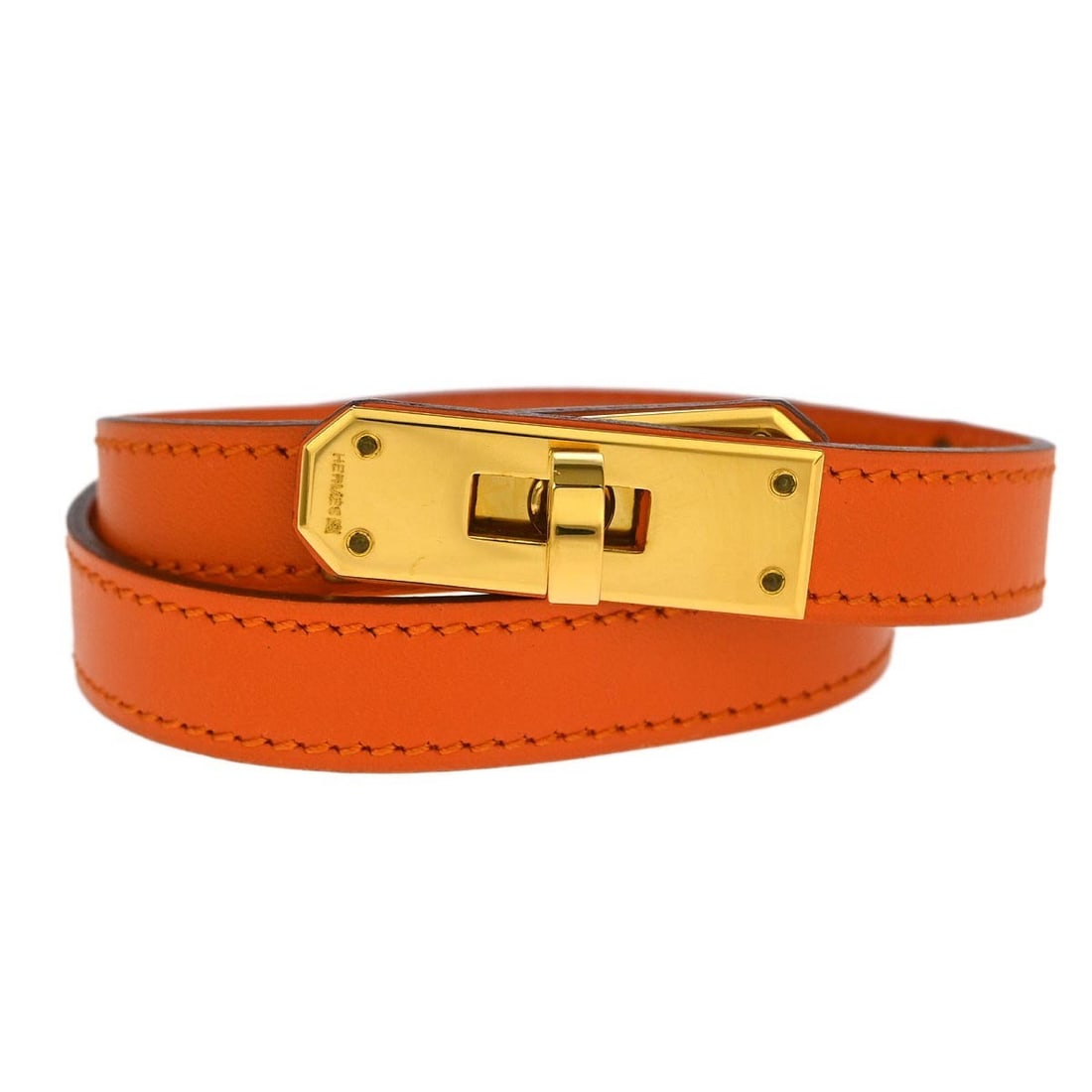 Hermes Kelly Double Tour Bracelet Orange Veau Gulliver Leather M#F: Hermes Kelly Double Tour Bracelet Orange Veau Gulliver Leather M#F Hermes Kelly Double Tour bracelet in orange Veau Gulliver leather. This round bangle-style bracelet was made in France and includes t