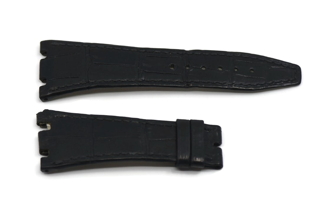Audemars Piguet Authentic Black Leather Strap 27mm for Royal Oak: Audemars Piguet Authentic Black Leather Strap 27mm for Royal Oak Enhance your timepiece with this authentic Audemars Piguet black leather wristwatch band. This two-piece strap is designed for comfort 