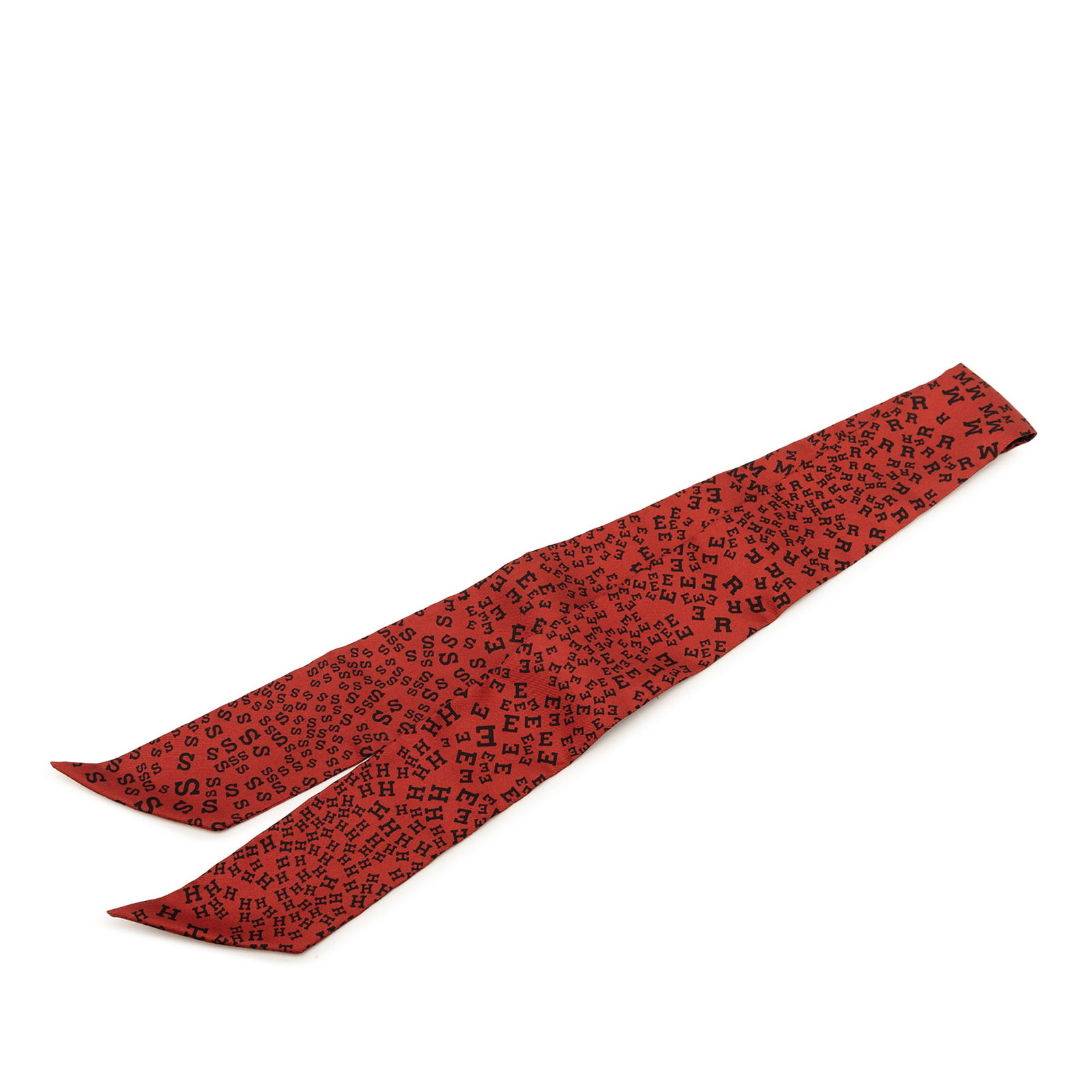 Hermes red silk Twilly scarf Scattered Letters: Hermes red silk Twilly scarf Scattered Letters This Hermes Scattered Letters Twilly Silk Scarf features a vibrant print on 100% silk in a striking red color. Made in France, this accessory is designed