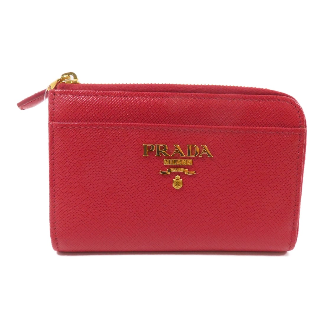 Prada Red Saffiano Leather 1PP122 Key Holder and Coin Purse: Prada Red Saffiano Leather 1PP122 Key Holder and Coin Purse This Prada coin purse features durable Saffiano leather in a vibrant red color. Designed with a regular size type, it is crafted in Italy an