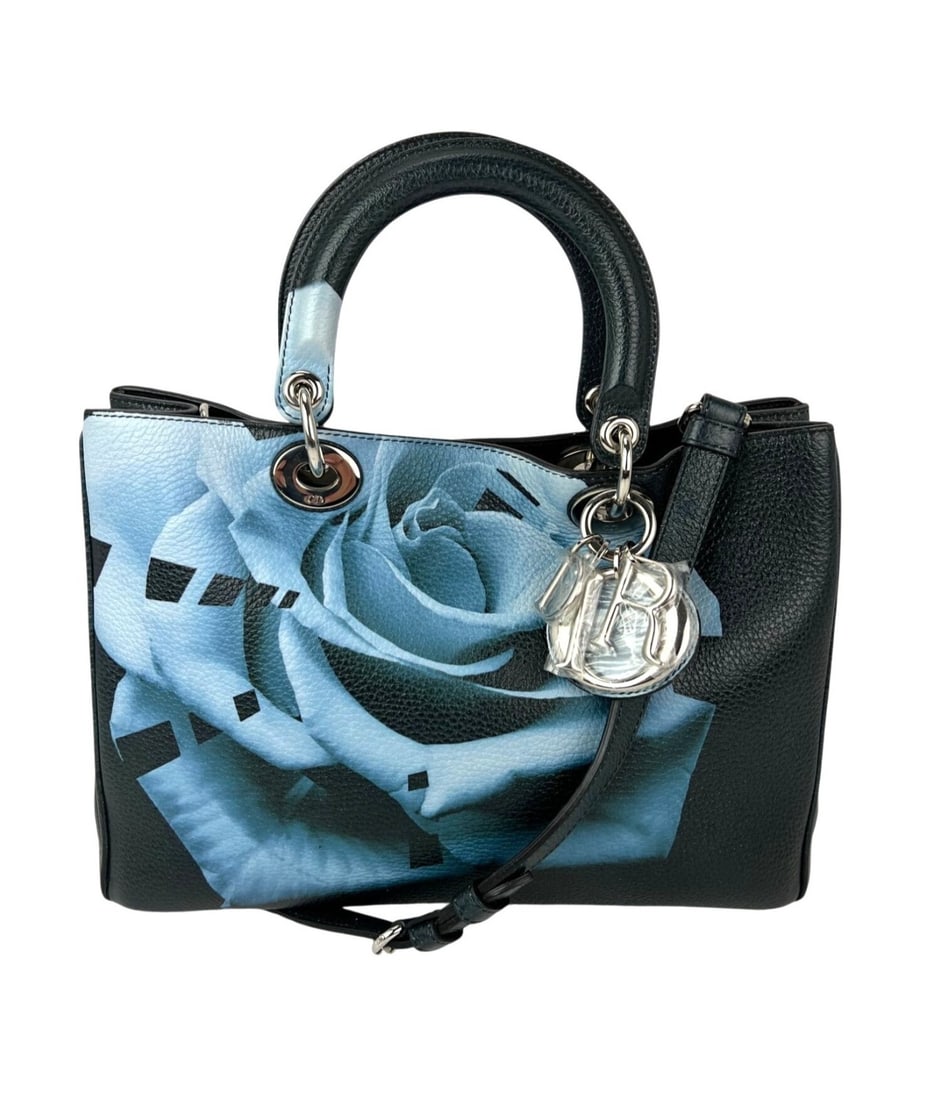 Dior Lady Floral Leather Tote Bag Green Silver Hardware: Dior Lady Floral Leather Tote Bag Green Silver Hardware This Christian Dior Lady Dior tote bag is crafted from dark green leather and features a striking floral print applique. The bag offers both sty