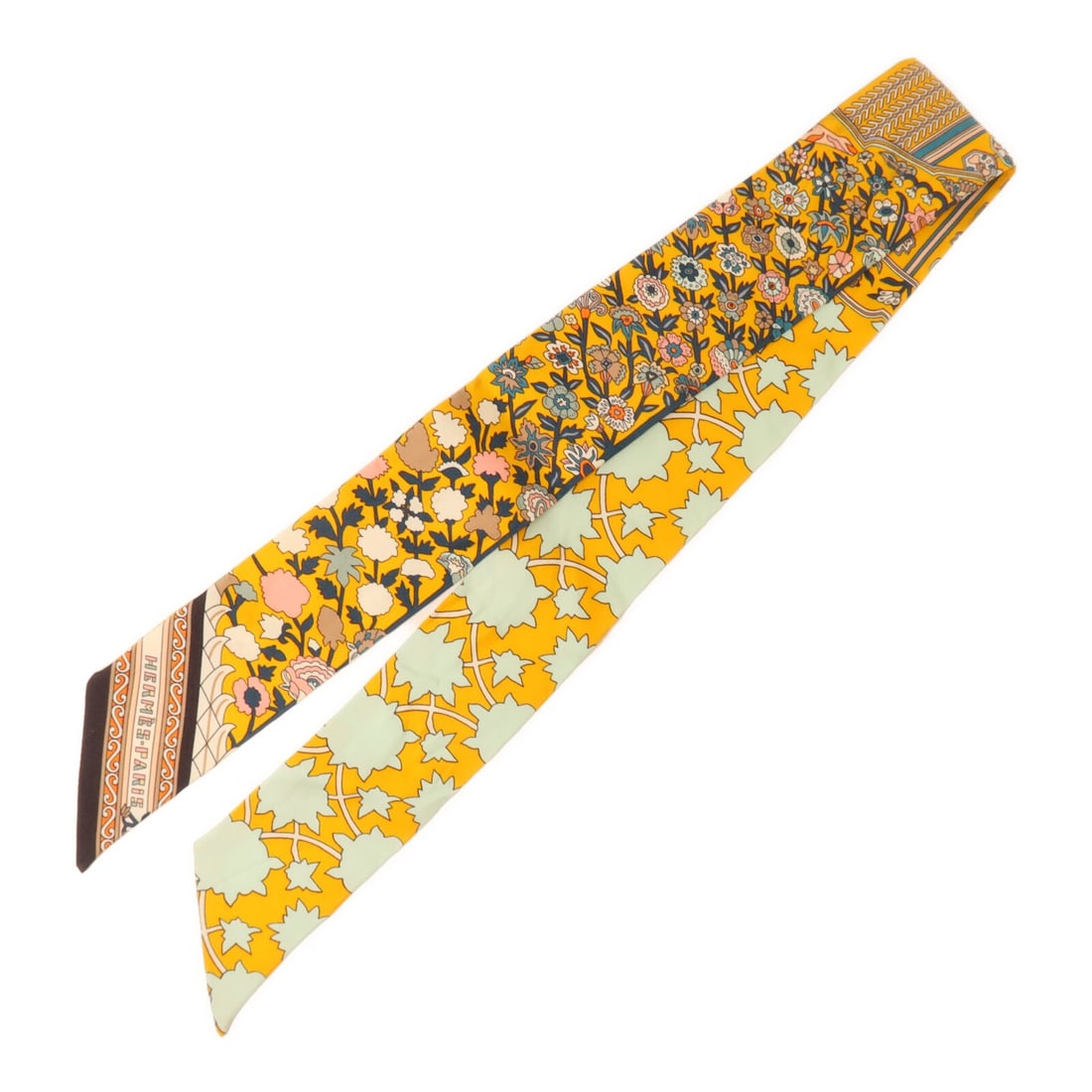 Hermes Silk Twilly Scarf Orange Green: Hermes Silk Twilly Scarf Orange Green This HERMES Twilly scarf is crafted from silk and features a vibrant orange and green color scheme. Designed for women, it is a regular size and made in France. T