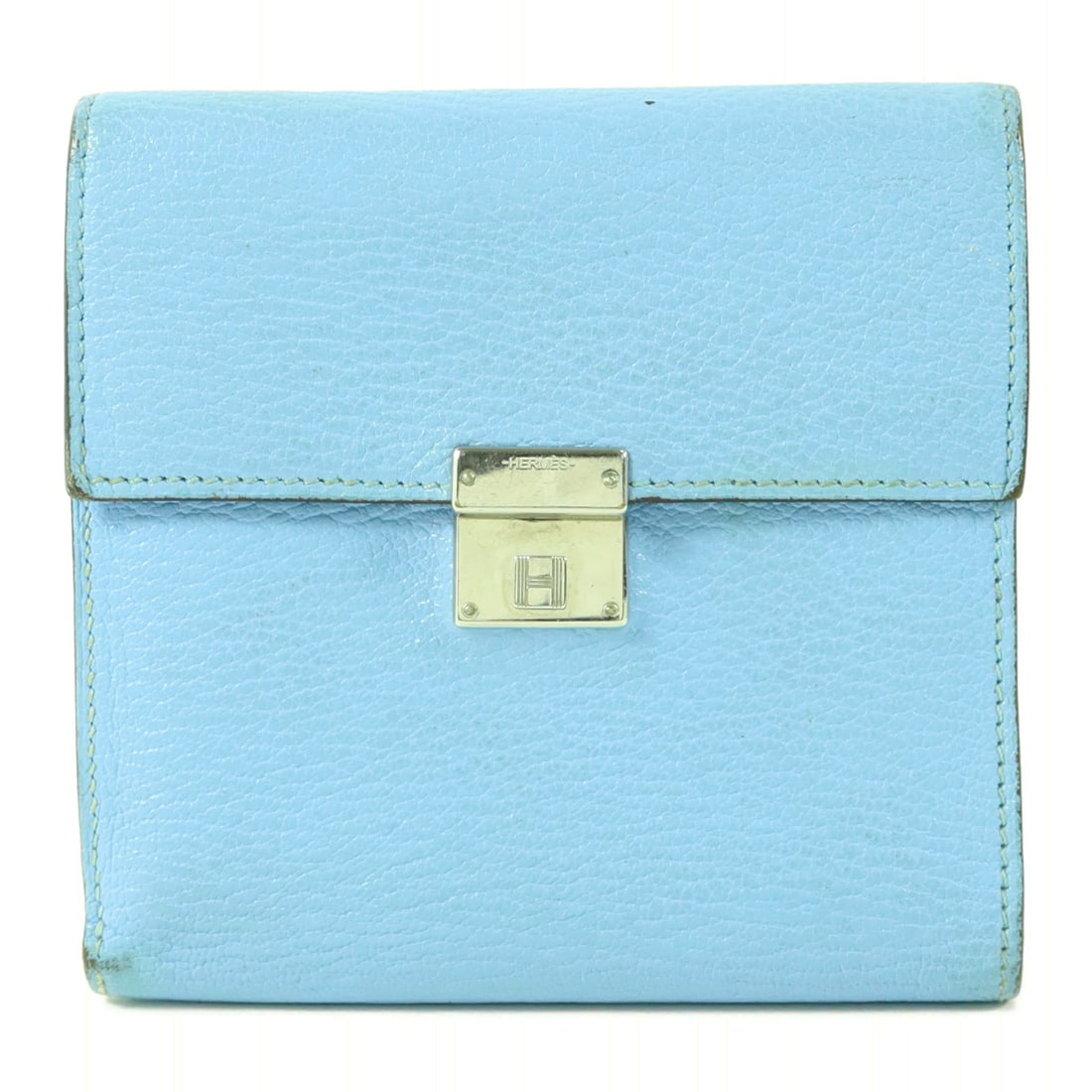 Hermes Clic 12 tri-fold goatskin wallet Celeste: Hermes Clic 12 tri-fold goatskin wallet Celeste This Hermes Clic 12 tri-fold wallet is crafted from chevre (goat) leather in a striking blue hue. Designed for women, it features a practical tri-fold s