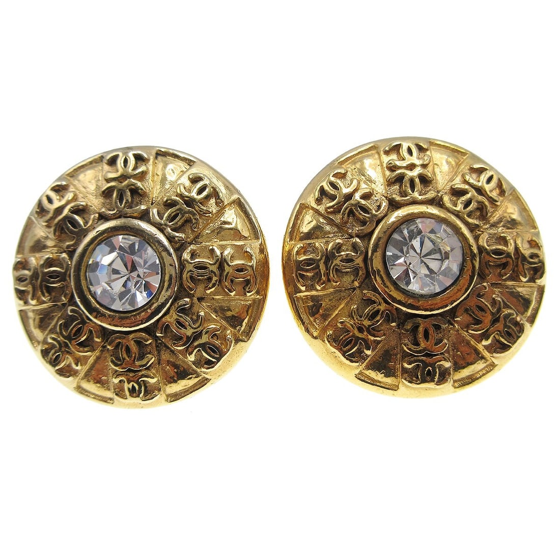 Chanel CC Logo Button Clip-On Earrings Gold Tone Rhinestone: Chanel CC Logo Button Clip-On Earrings Gold Tone Rhinestone Pair of Chanel button-style clip-on earrings featuring the CC logo motif and a central rhinestone accent. Made in France, these gold-tone ea