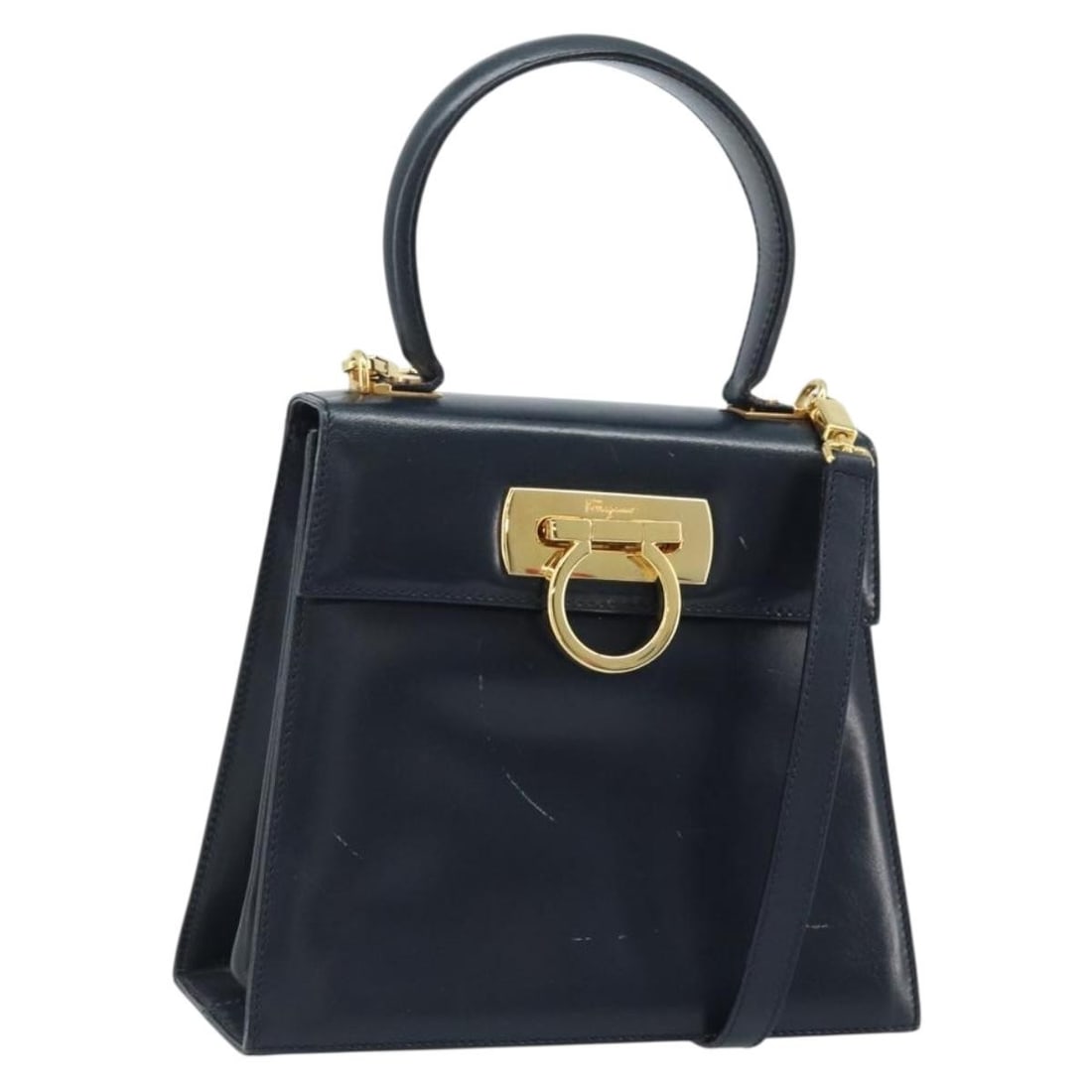 Salvatore Ferragamo Gancini Navy Leather Convertible Shoulder Handbag with Strap: Salvatore Ferragamo Gancini Navy Leather Convertible Shoulder Handbag with Strap This Salvatore Ferragamo Gancini handbag is crafted from navy leather and features a versatile 2-way design. It has gol