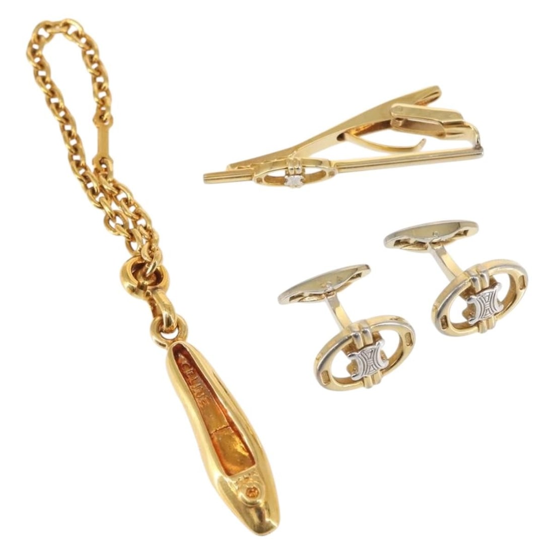 CELINE Gold Metal Accessory Case Set of 2 Authentic: CELINE Gold Metal Accessory Case Set of 2 Authentic This exquisite CELINE accessory case set features two elegantly designed metal cases in a luxurious gold finish. While the exterior shows some scrat