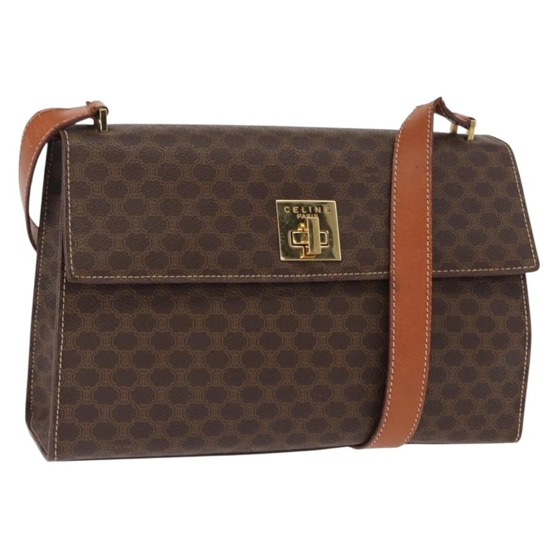 CELINE Brown Macadam Canvas Shoulder Bag with PVC Leather Trim: CELINE Brown Macadam Canvas Shoulder Bag with PVC Leather Trim This Celine Macadam shoulder bag is crafted from durable PVC leather and Macadam canvas in brown and gold tones. The bag features a spaci