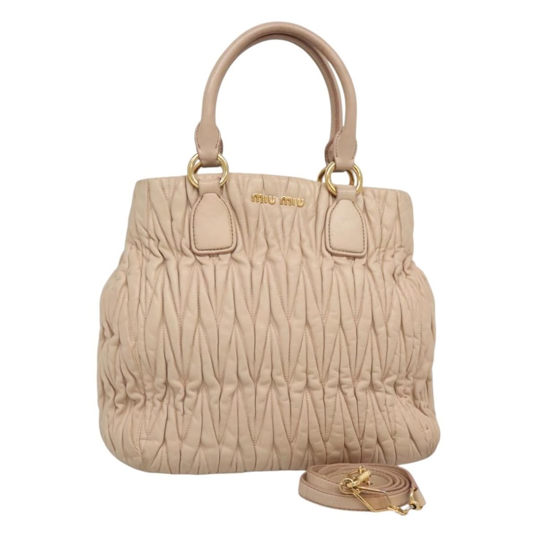 Miu Miu Matelasse Leather 2way Handbag Beige with Shoulder Strap: Miu Miu Matelasse Leather 2way Handbag Beige with Shoulder Strap Miu Miu matelasse leather 2-way handbag in beige with gold-tone accents. This women's handbag includes a shoulder strap and can be carr