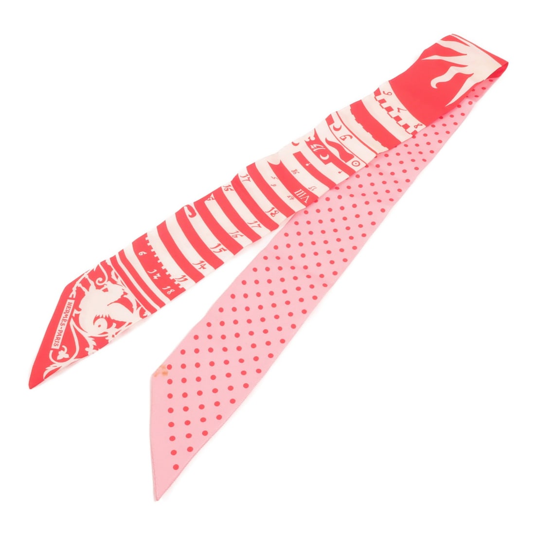 Hermes Twilly Silk Scarf Red Pink: Hermes Twilly Silk Scarf Red Pink This Hermes Twilly scarf is crafted from luxurious silk and features a vibrant red and pink color palette. Designed for women, this regular size scarf showcases the b