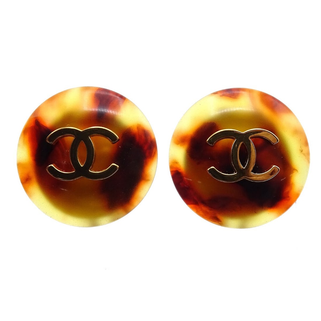 Chanel 97P Logo Clip-On Earrings Gold Plated Acrylic Brown: Chanel 97P Logo Clip-On Earrings Gold Plated Acrylic Brown Clip-on Chanel button earrings featuring the house logo motif in brown acrylic with gold-plated metal. Marked 97P and made in France, this pa
