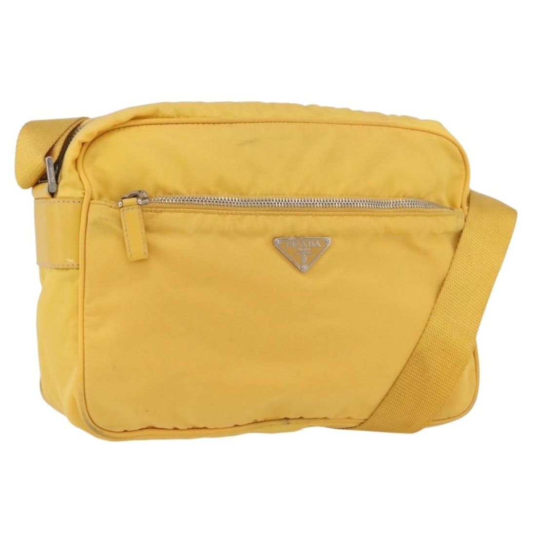 Prada yellow nylon shoulder bag with guarantee card: Prada yellow nylon shoulder bag with guarantee card This PRADA shoulder bag features a vibrant yellow and silver nylon exterior, offering a contemporary look. Made in Italy, it is designed with practi
