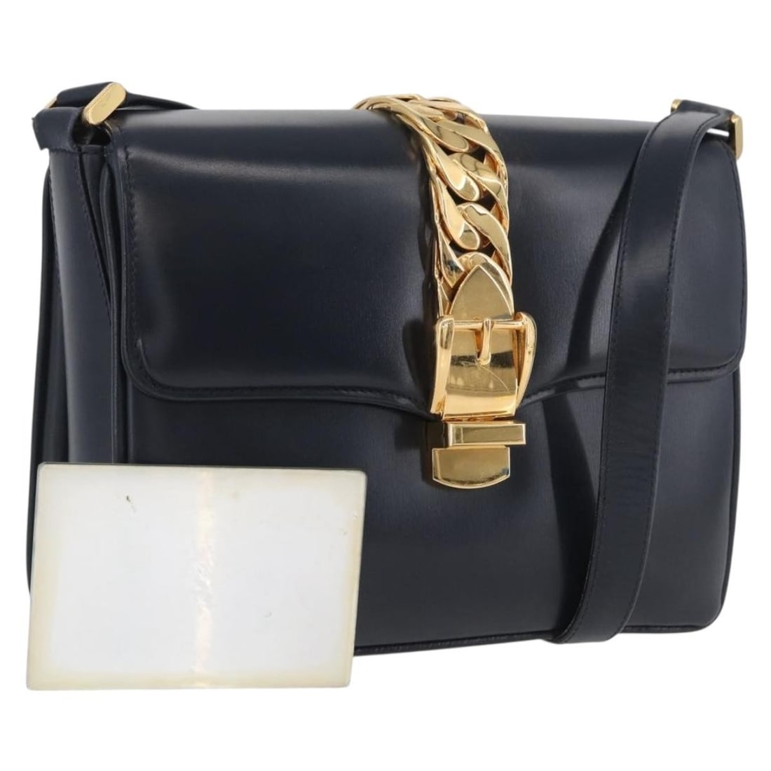 Gucci Navy Leather Shoulder Bag with Gold Accents and Mirror: Gucci Navy Leather Shoulder Bag with Gold Accents and Mirror This GUCCI shoulder bag is crafted from navy leather with gold-tone accents, designed for women. The bag features a compact silhouette with