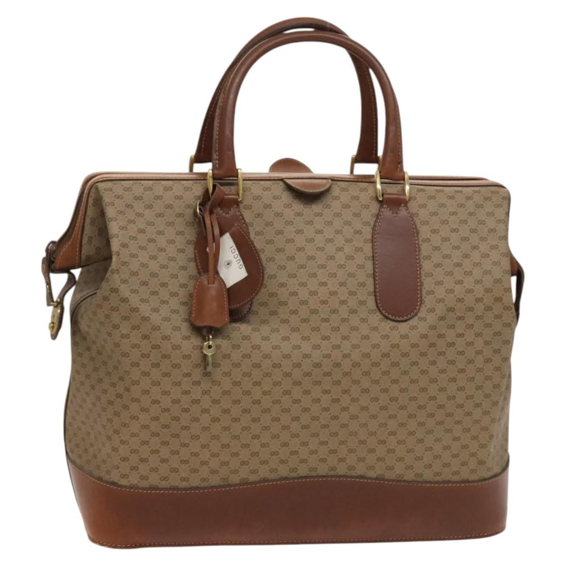 Gucci Micro GG Supreme beige gold Boston bag with keys and clochette: Gucci Micro GG Supreme beige gold Boston bag with keys and clochette This is a Gucci Micro GG Supreme Boston Bag crafted from beige and gold PVC leather with Micro Small GG canvas accents. Designed fo