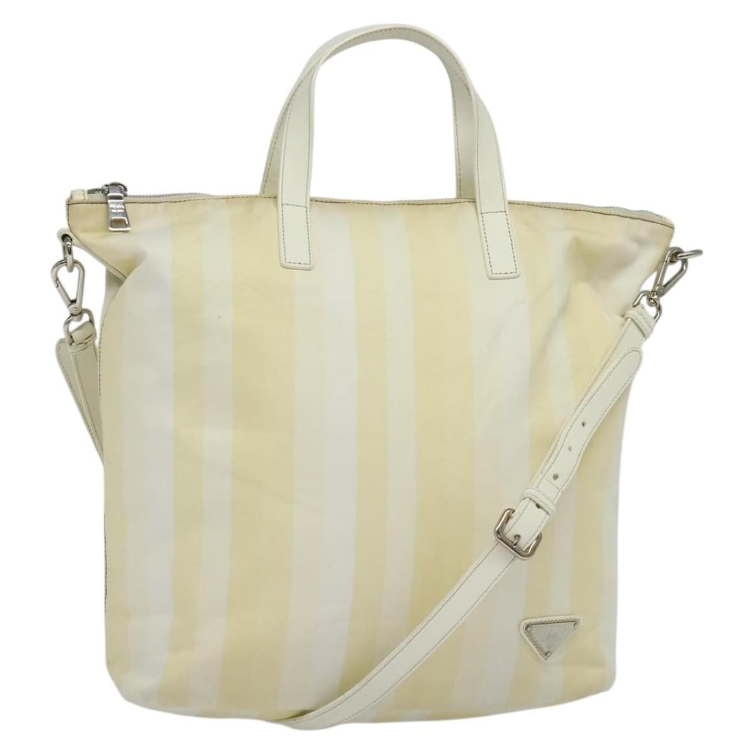 PRADA Beige Nylon 2way Hand Bag with Shoulder Strap: PRADA Beige Nylon 2way Hand Bag with Shoulder Strap Prada 2-way handbag in beige nylon with silver-tone accents. Designed for women, this Italy-made bag includes a shoulder strap and can be carried by
