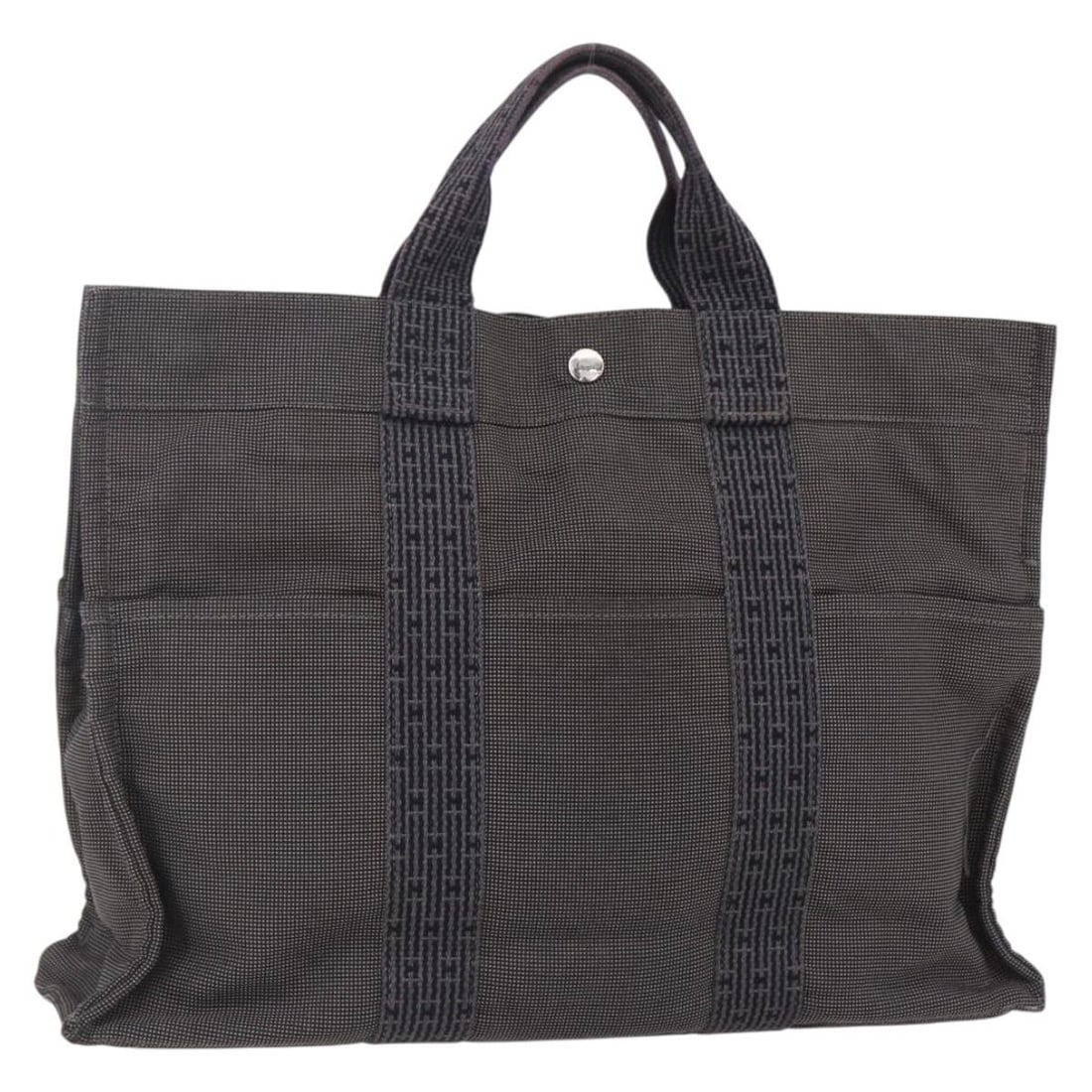 HERMES Her Line Gray Canvas Hand Bag Made in France: HERMES Her Line Gray Canvas Hand Bag Made in France Discover the elegance of the HERMES Her Line Hand Bag, crafted in France from durable gray canvas. This stylish hand bag features a spacious interio