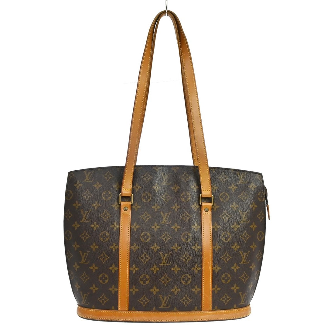Louis Vuitton Babylone Monogram Canvas Tote Bag M51102: Louis Vuitton Babylone Monogram Canvas Tote Bag M51102 Vintage Louis Vuitton Babylone tote bag in brown Monogram canvas with leather trim and double handles. This zip-top handbag features a brown lini