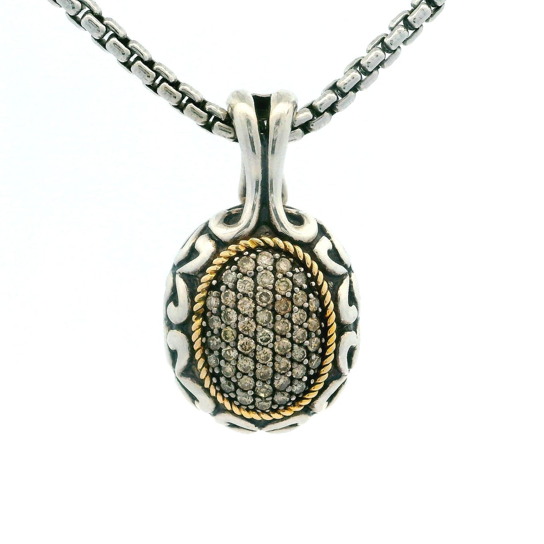 Sterling Silver 14k Gold Diamond Oval Pendant with Box Link Chain: Sterling Silver 14k Gold Diamond Oval Pendant with Box Link Chain This stunning pendant necklace features a captivating oval dome enhancer design, crafted from high-quality sterling silver and accente