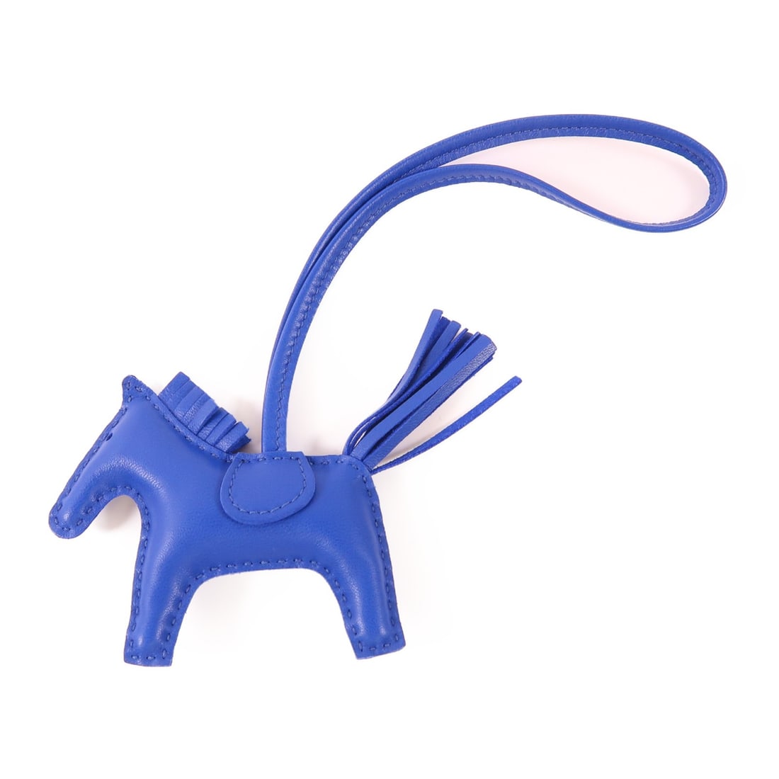 Hermes Rodeo PM Blue Lambskin Leather Bag Charm Accessory: Hermes Rodeo PM Blue Lambskin Leather Bag Charm Accessory Introducing the HERMES Rodeo PM Charm crafted from high-quality lambskin leather in a vibrant blue hue. This exquisite charm is designed to el