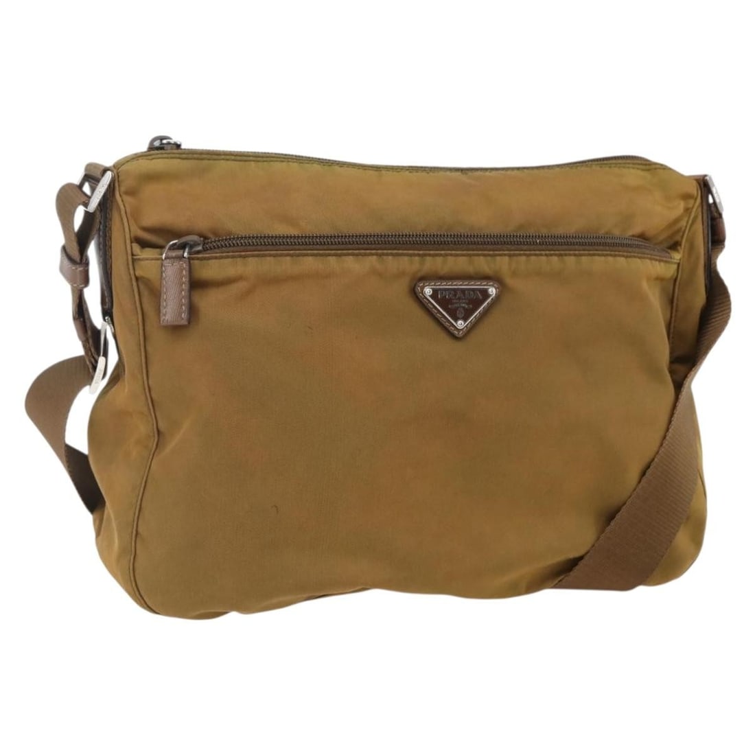 PRADA Nylon Shoulder Bag in Beige with Silver Tone: PRADA Nylon Shoulder Bag in Beige with Silver Tone Authentic Prada shoulder bag in beige nylon with silver-tone exterior accents. Made in Italy, this women's bag has a heavily used condition with visi