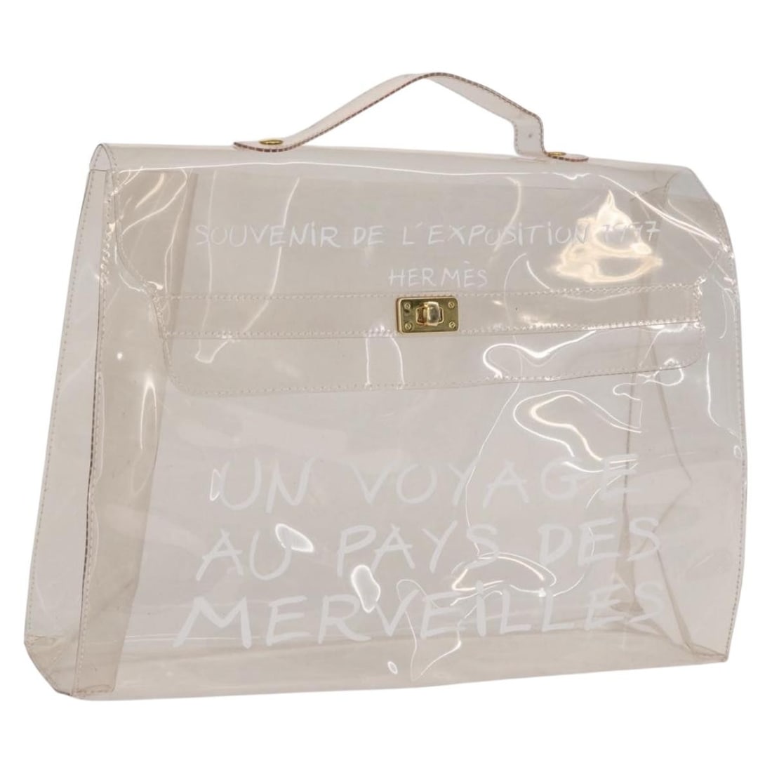 Clear Vinyl Kelly Handbag by Hermes Transparent French Designer Bag: Clear Vinyl Kelly Handbag by Hermes Transparent French Designer Bag This Hermes Kelly hand bag is crafted from clear vinyl and features the iconic Kelly silhouette. The bag is designed with a top hand