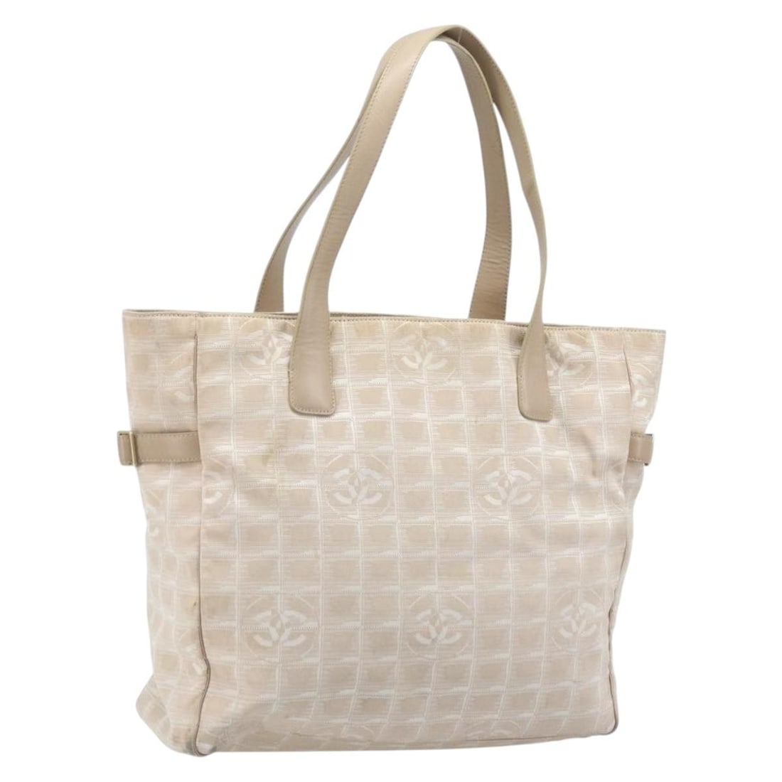 Beige Nylon Tote with Gold CC Logo by Chanel New Travel Line: Beige Nylon Tote with Gold CC Logo by Chanel New Travel Line This CHANEL Travel Line tote bag features a beige and gold nylon exterior with signature CC detailing. Designed for women, the bag offers a