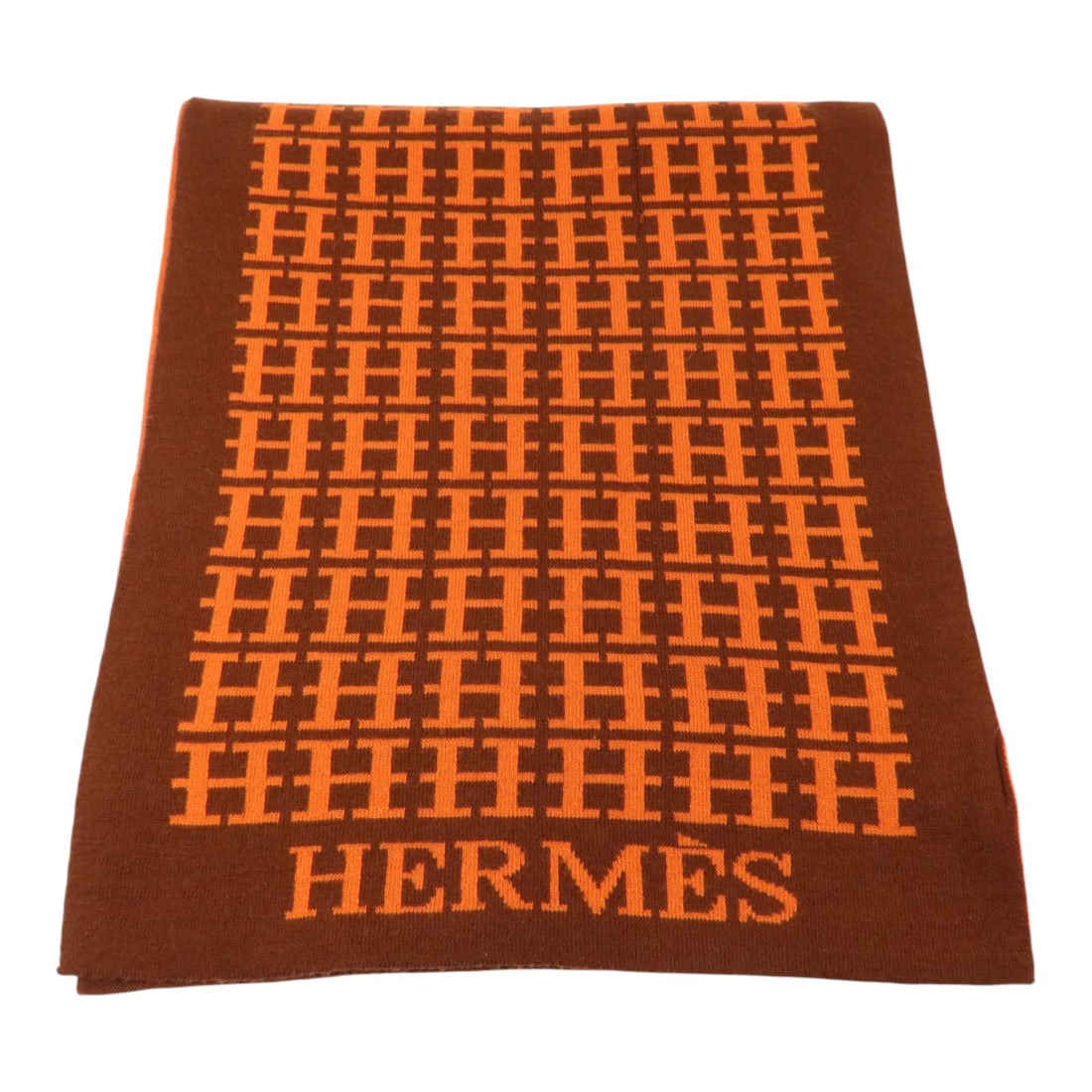 Hermes Wool Orange Brown Women Scarf 180x32cm: Hermes Wool Orange Brown Women Scarf 180x32cm This Hermes scarf is crafted from wool and features a vibrant orange and brown color scheme. Made in France, it is designed for women and offers a classic