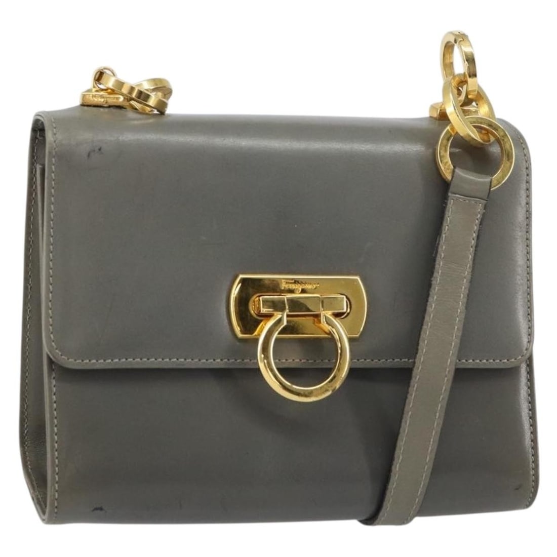 Salvatore Ferragamo Gray Gold Leather Gancini Shoulder Bag: Salvatore Ferragamo Gray Gold Leather Gancini Shoulder Bag This Salvatore Ferragamo Gancini chain shoulder bag is crafted from gray leather with gold-tone accents. Made in Italy, it features a compact
