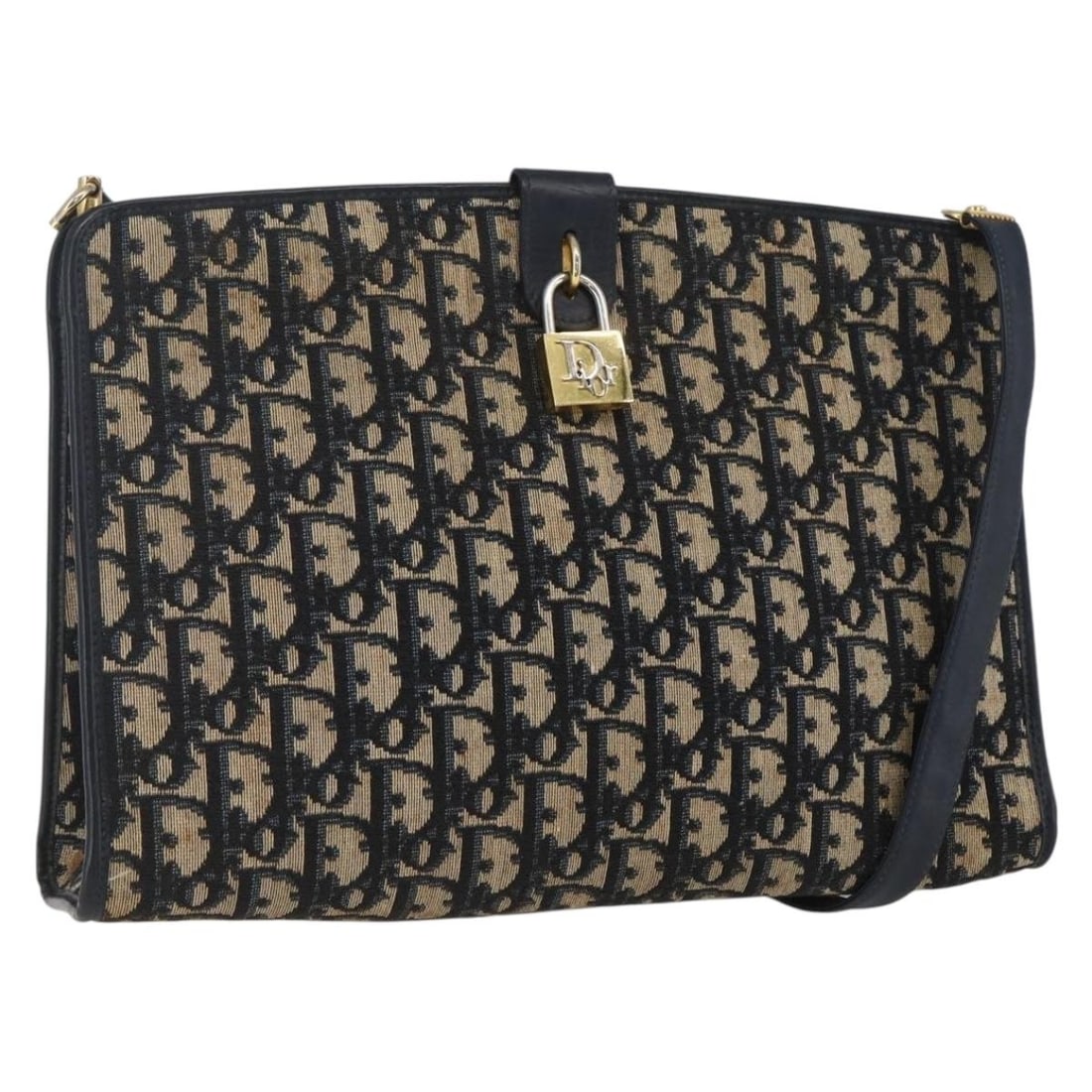 Navy Trotter Canvas Shoulder Bag by Christian Dior Gold Accents: Navy Trotter Canvas Shoulder Bag by Christian Dior Gold Accents This Christian Dior Trotter Canvas Shoulder Bag features a navy and gold color scheme with the iconic Trotter canvas exterior. The bag i