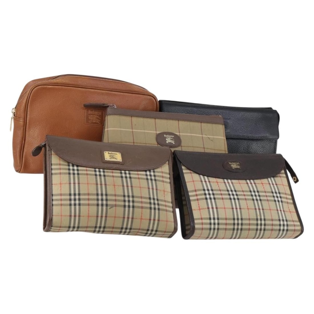 Burberrys Nova Check canvas clutch bag beige black: Burberrys Nova Check canvas clutch bag beige black Set of 5 Burberrys clutch bags in beige and black canvas with leather trim. This women's clutch bag set shows heavy use, with overall wear noted thro