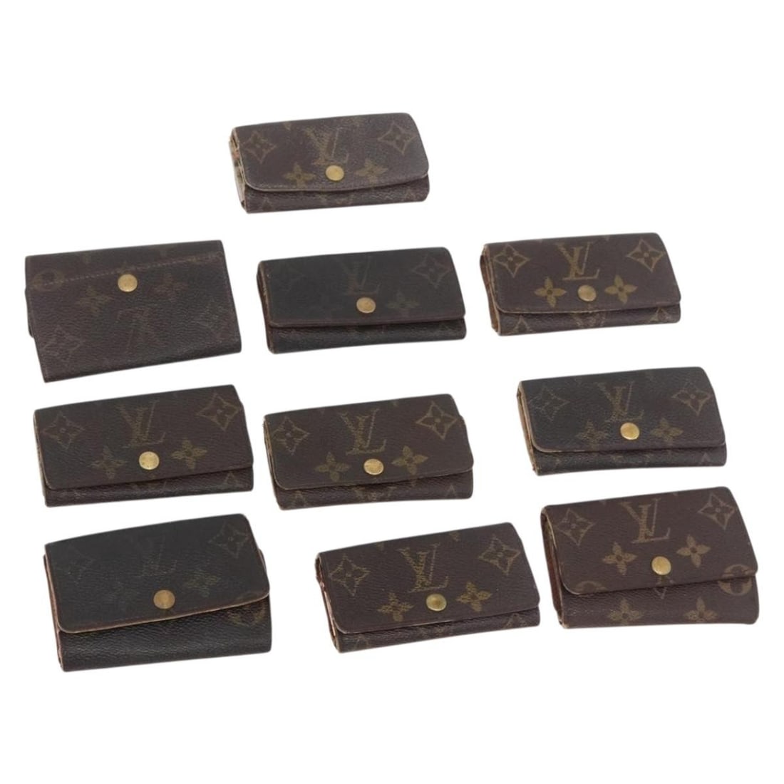 Louis Vuitton Monogram Canvas Key Case 10 Piece Set: Louis Vuitton Monogram Canvas Key Case 10 Piece Set This Louis Vuitton Monogram Key Case is crafted from the brand's signature monogram canvas and is designed for women. The item is made in France and