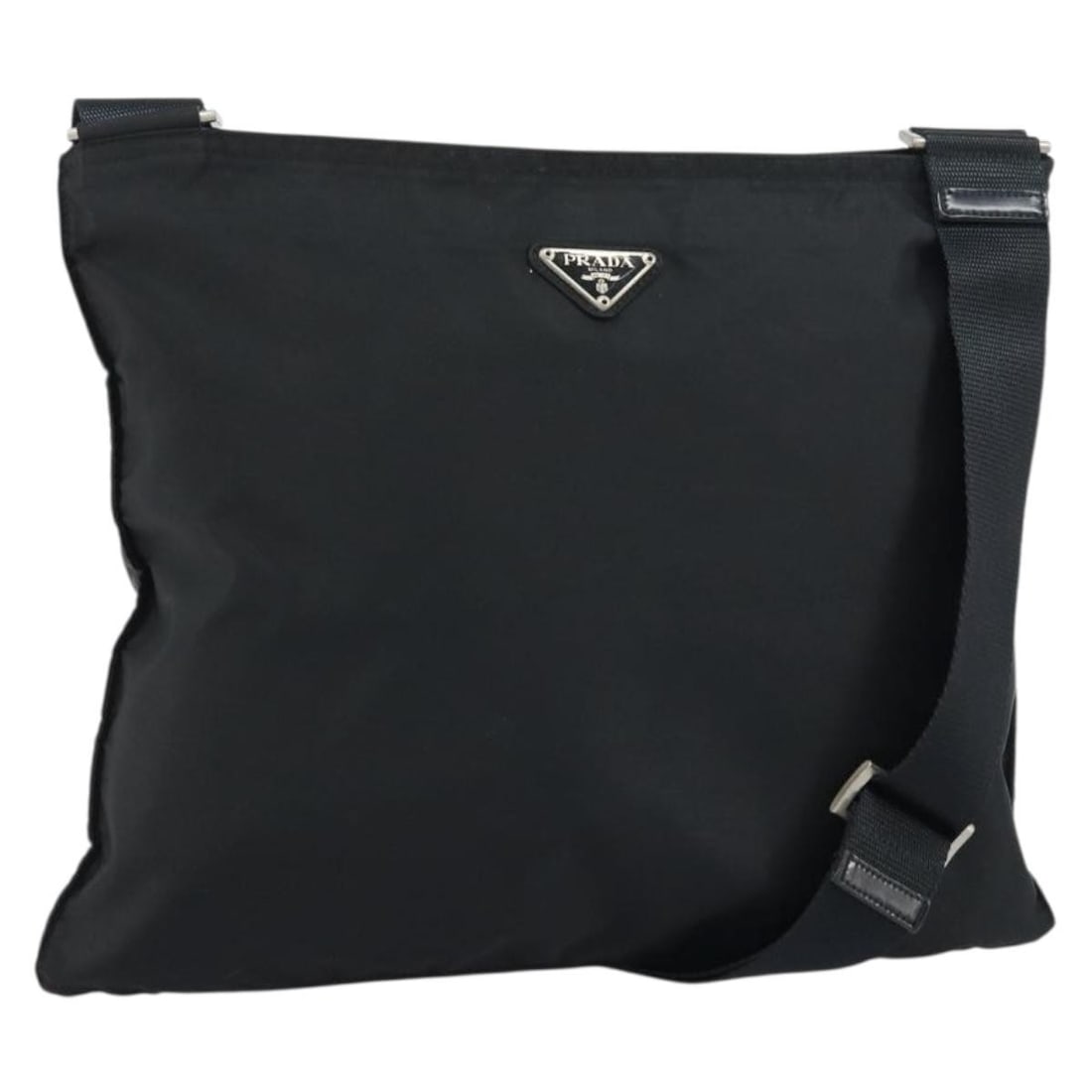 Prada black nylon women s shoulder bag Italy silver trim: Prada black nylon women s shoulder bag Italy silver trim This PRADA shoulder bag is crafted from black nylon with silver-tone accents, offering a stylish and practical accessory for everyday use. Made