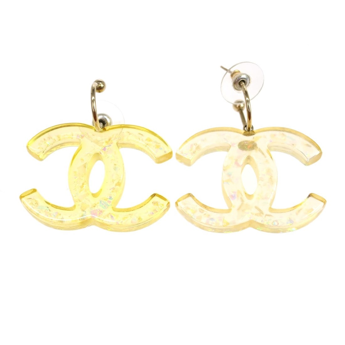 Chanel 06P Gold Plated Clear Acrylic Pierced Earrings: Chanel 06P Gold Plated Clear Acrylic Pierced Earrings Chanel pierced earrings in gold and clear tones with a screw back closure. Made in France, this pair is crafted from gold-plated metal and acrylic