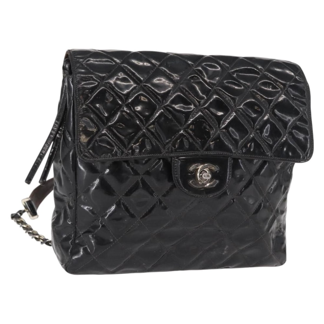 Black Enamel Matelasse 25 Backpack by CHANEL with Silver Chain Detailing: Black Enamel Matelasse 25 Backpack by CHANEL with Silver Chain Detailing This CHANEL Matelasse 25 chain backpack features a sleek black and silver enamel exterior with silver CC accents. The backpack 