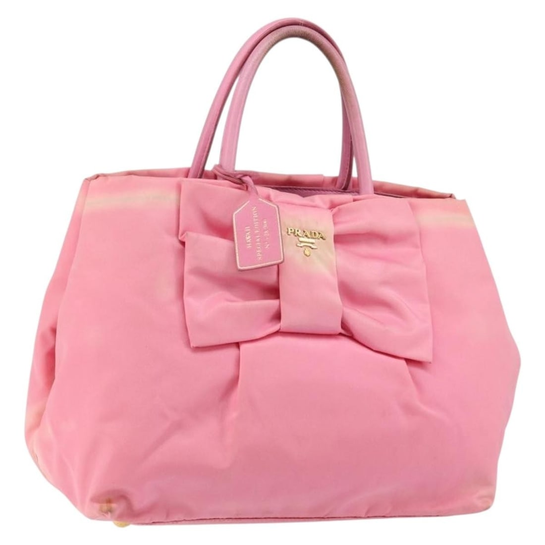 Prada pink nylon women s handbag made in Italy: Prada pink nylon women s handbag made in Italy This PRADA handbag is crafted from pink and gold nylon, offering a stylish and functional accessory for women. Made in Italy, the bag features a compact 
