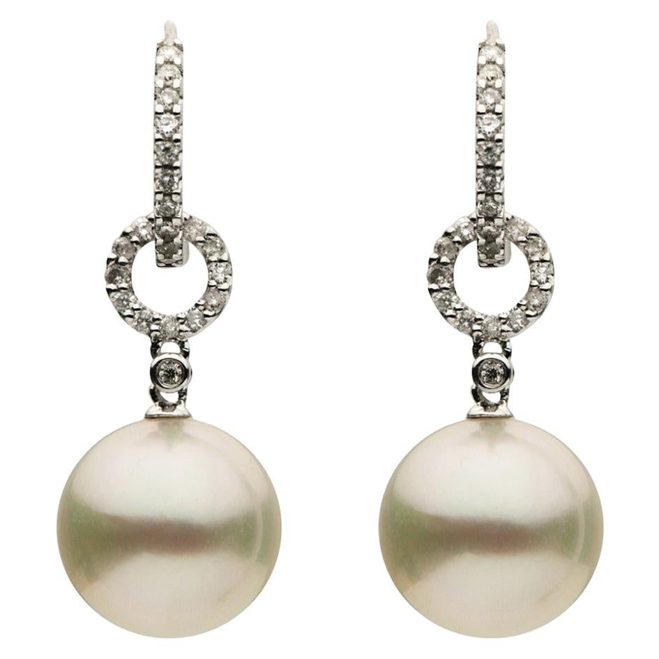 Harbor Diamonds 18K White Gold South Sea Pearl Diamond Earrings 0.29 Carats: Harbor Diamonds 18K White Gold South Sea Pearl Diamond Earrings 0.29 Carats Elegant 18K white gold drop earrings showcasing two stunning South Sea pearls, each measuring 10-11 mm. These exquisite earr