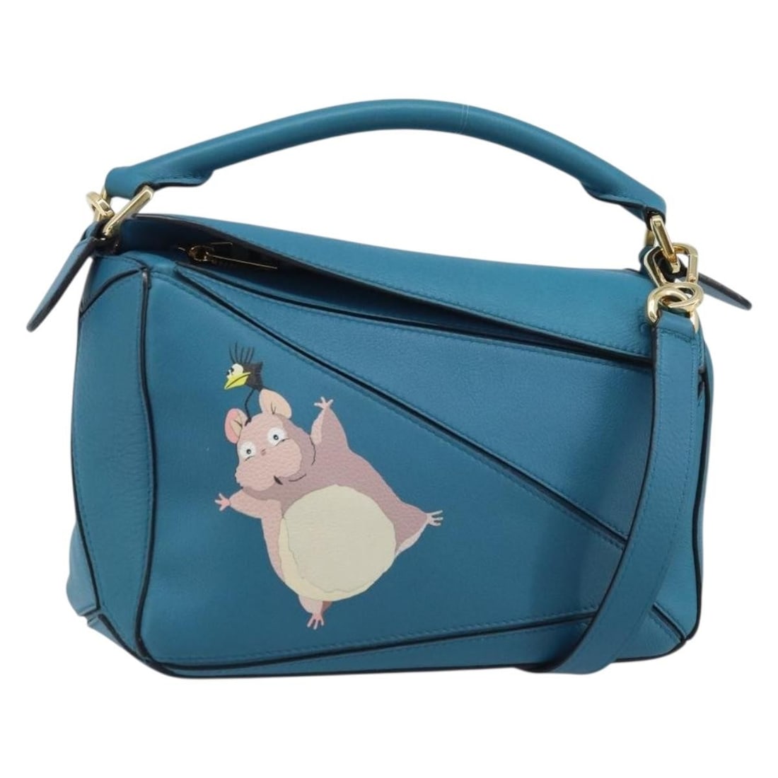 Loewe Studio Ghibli Puzzle Leather Blue Gold Handbag with Strap and Dust Bag: Loewe Studio Ghibli Puzzle Leather Blue Gold Handbag with Strap and Dust Bag This LOEWE x Studio Ghibli Puzzle bag is a stylish 2-way hand bag crafted from high-quality leather in blue and gold tones.