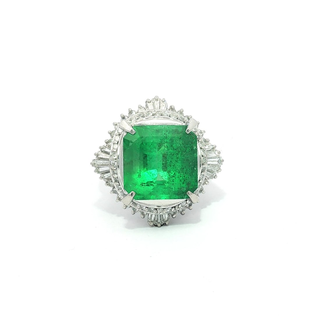 GIA Certified 7.38ct Colombian Emerald Platinum Diamond Ballerina Ring: GIA Certified 7.38ct Colombian Emerald Platinum Diamond Ballerina Ring This exquisite platinum cocktail ring features a stunning 6.53 carat Colombian emerald, known for its vibrant green color and exc