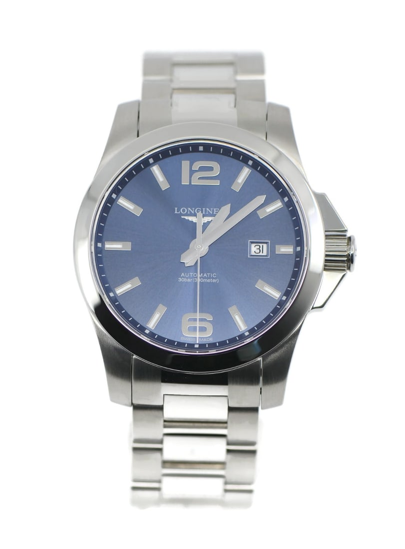 Longines Conquest automatic wristwatch blue dial ref L37784966: Longines Conquest automatic wristwatch blue dial ref L37784966 Pre-owned Longines Conquest wristwatch with a blue analog dial and stainless steel case and bracelet. This automatic watch features 21 je